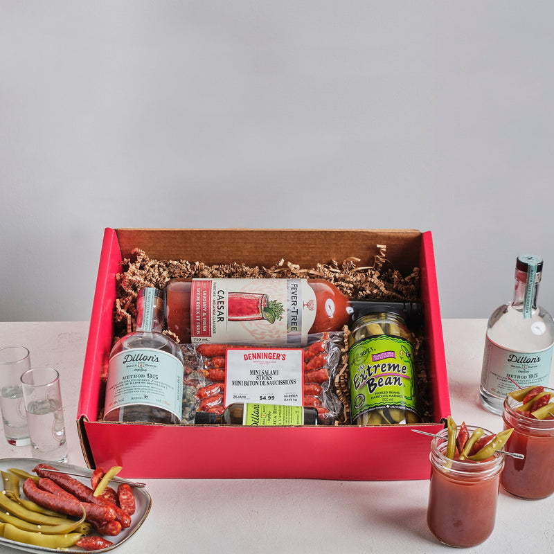 A box filled with everything you need to make a classic Caesar drink, it includes the vodka, Caesar mix, spicy beans, and Denninger's Salami sticks