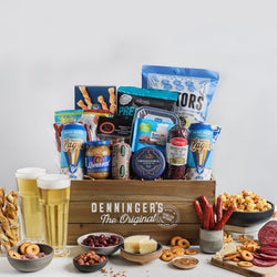 The meat and beer crate gift basket includes a variety of meats (mini salami sticks, pate, salami), salty snacks, popcorn, cheese, sweets and two Nickel Brook beers. All wrapped up in a wooden crate.