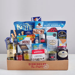 Our large basket is a selection of sweet and salty snacks, salami, brie, pickles, mustard, tea, and more. 