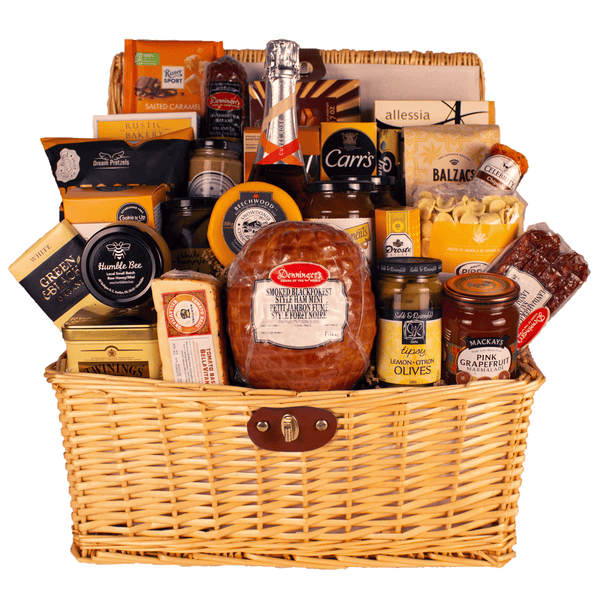 A grand gourmet gift basket with a very large selection of meat and cheese, a mini ham, pasta and sauce, snacks, chocolate and more. Includes a bottle of Cuvée Rosé sparkling wine wrapped in a picnic basket.