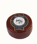 Encased in a deep red wax 200 grams of Snowdonia Red Storm Aged for 18 months red hard ripened cheese.