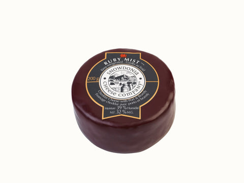 Encased in purple wax 200 grams of Snowdonia Ruby Mist - Cheddar cheese with port and brandy.