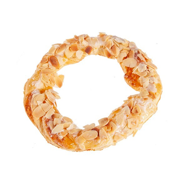 This ring shaped pastry is slightly sweet marzipan between layers of French puff pastry. Twisted, bound and lightly baked. Smothered with icing and topped with oven roasted almonds.