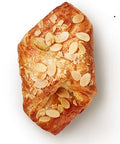 A golden butter croissant with a mouth-watering almond filling.
