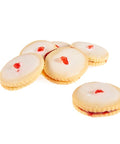 6 pieces of a jam filled sandwich cookie topped with a vanilla glaze and finished with a candied cherry piece.