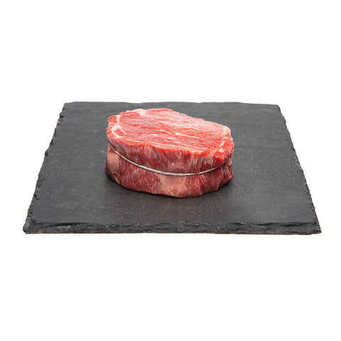 8 oz piece of Raw Canadian AAA Beef Rib Eye Steak - Delmonico Style.