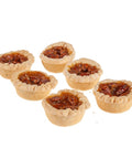 Picture of six loose pecan  tarts.