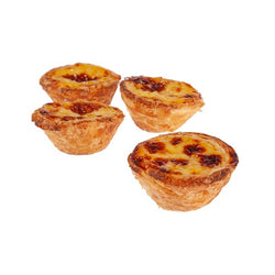 Four tarts with a creamy custard center blistered on top. The tarts are crispy, flaky crusty.
